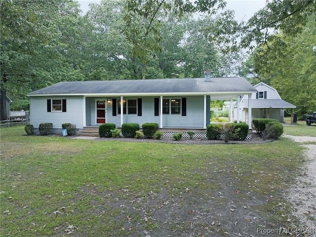 ranch-style house with covered porch and a front lawn