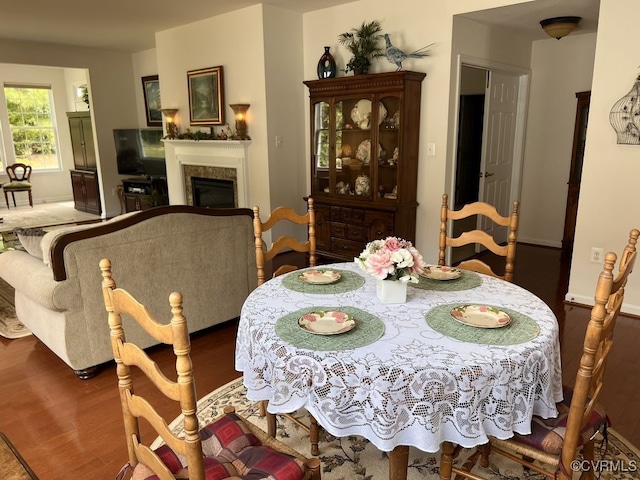 dining area featuring dark wood-type flooring