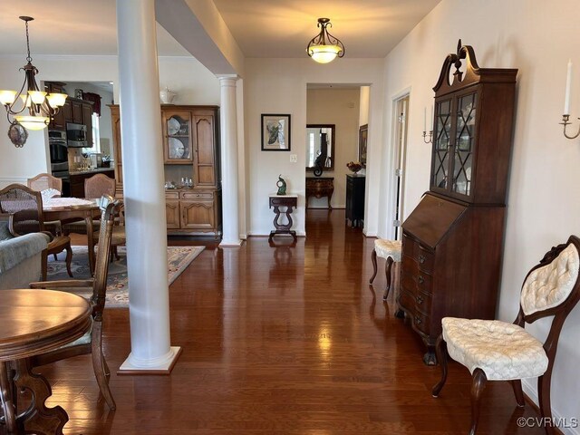 8232 E Lord Botetourt Loop, New Kent, VA 23124 - hall featuring dark wood finished floors, an inviting chandelier, baseboards, and ornate columns