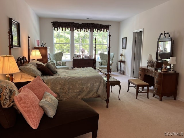 carpeted bedroom featuring multiple windows