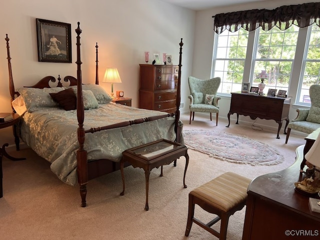 bedroom featuring light carpet