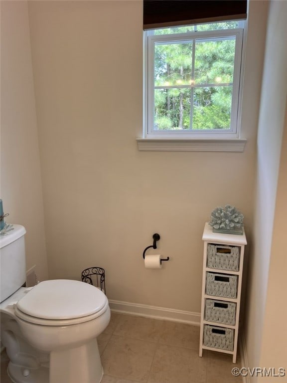 bathroom featuring tile patterned flooring and toilet