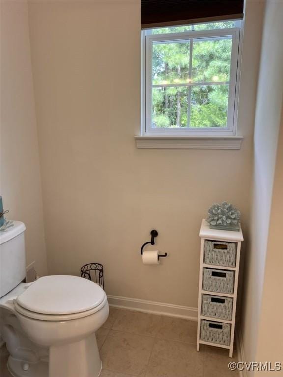 8232 E Lord Botetourt Loop, New Kent, VA 23124 - half bath featuring baseboards, toilet, and tile patterned flooring