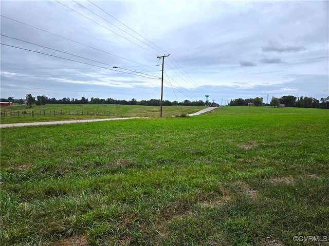 view of yard with a rural view