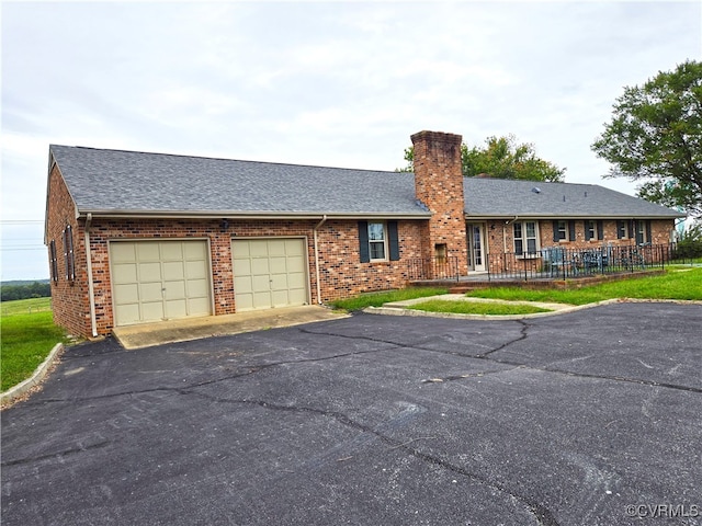 ranch-style home with a garage