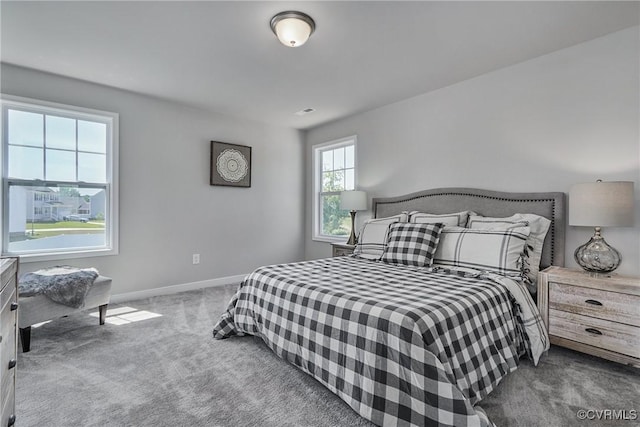 carpeted bedroom with baseboards