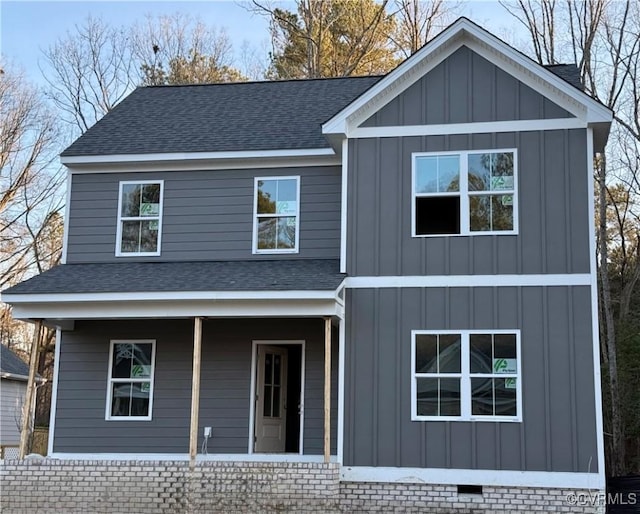 view of front of home with crawl space, a shingled roof, a porch, and board and batten siding