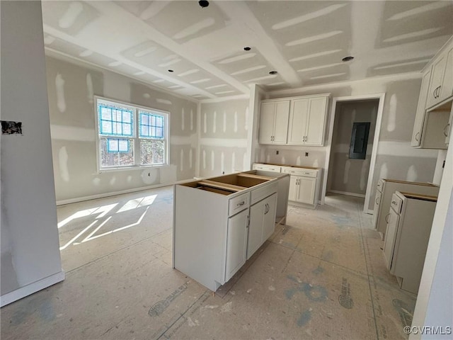 kitchen featuring white cabinetry and a center island