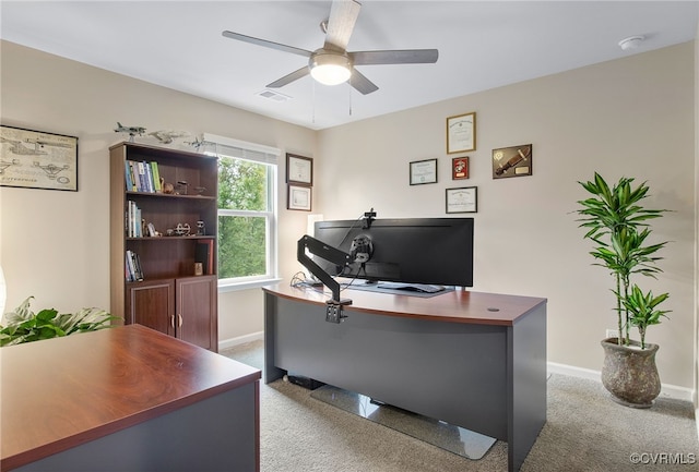 home office featuring carpet floors and ceiling fan