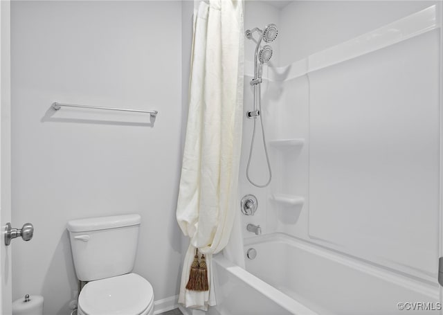 bathroom with shower / bath combo and toilet