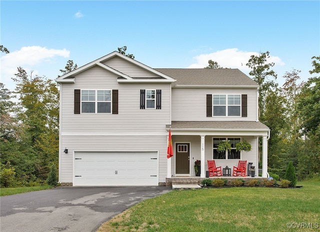 view of front facade with a porch, a garage, and a front lawn