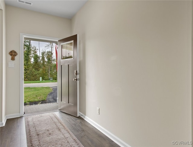 foyer entrance with dark wood-type flooring