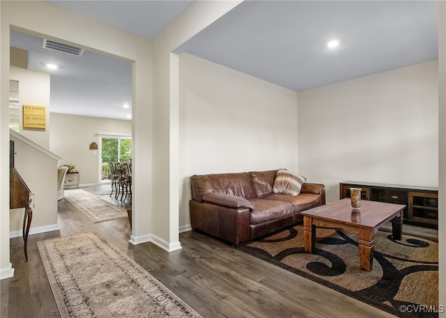 living room featuring dark hardwood / wood-style floors