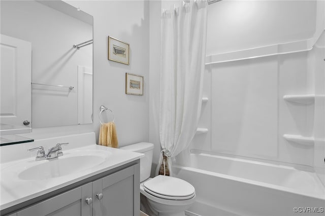 full bathroom with vanity, shower / tub combo, and toilet