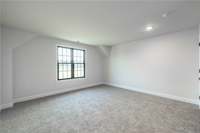 bonus room with carpet flooring