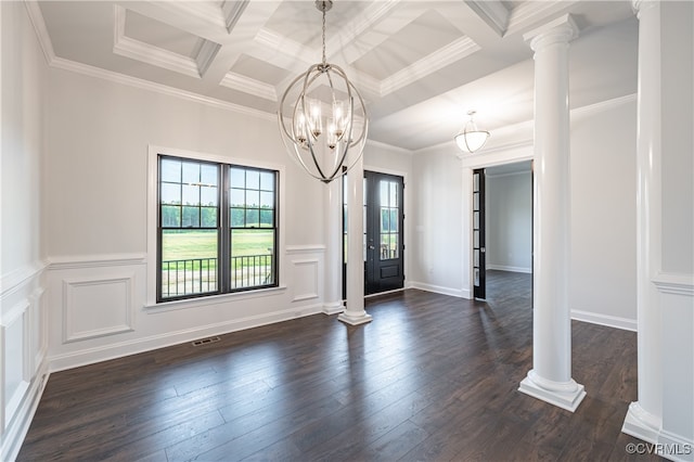 interior space with decorative columns, ornamental molding, dark hardwood / wood-style flooring, and a notable chandelier