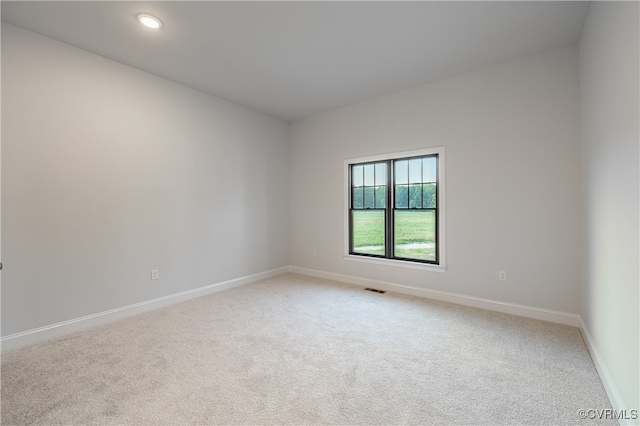 unfurnished room featuring carpet