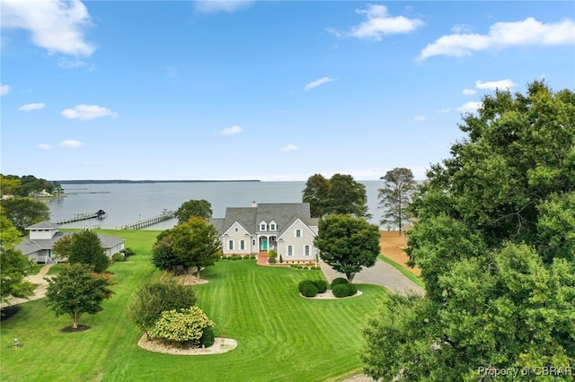 birds eye view of property with a water view