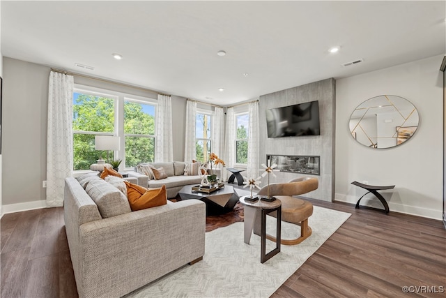 living room featuring hardwood / wood-style floors and a fireplace