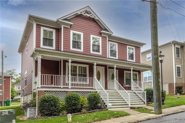 view of front of home with central AC and covered porch