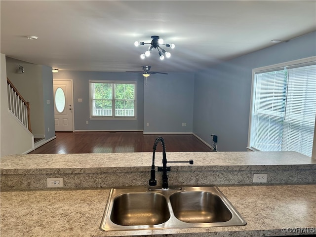 kitchen featuring ceiling fan, dark hardwood / wood-style floors, and sink