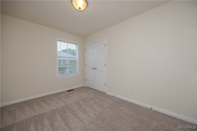 view of carpeted spare room