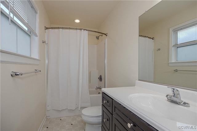 full bathroom with vanity, toilet, and shower / tub combo with curtain