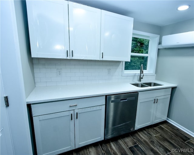 kitchen featuring white cabinets, sink, a wall mounted AC, stainless steel dishwasher, and dark hardwood / wood-style flooring