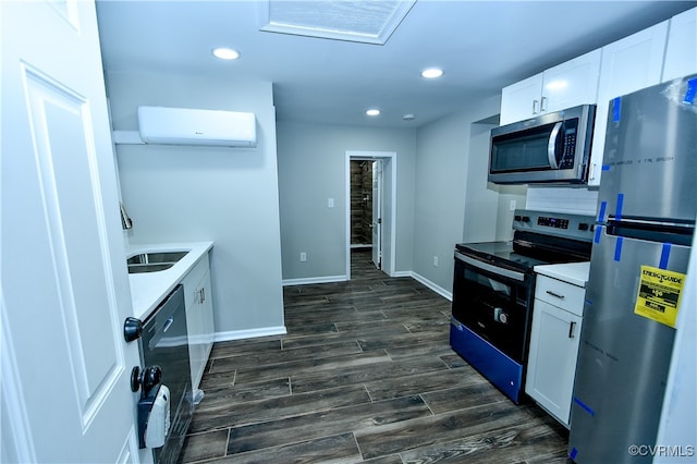 kitchen featuring dark hardwood / wood-style flooring, sink, a wall mounted air conditioner, black appliances, and white cabinetry