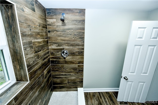 bathroom featuring a shower and hardwood / wood-style flooring