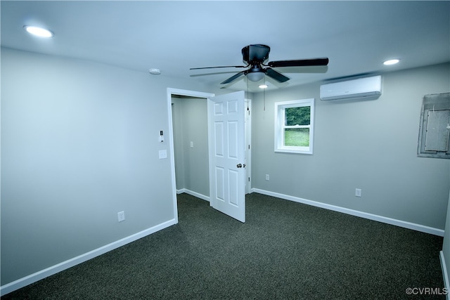 empty room featuring an AC wall unit, electric panel, ceiling fan, and dark carpet