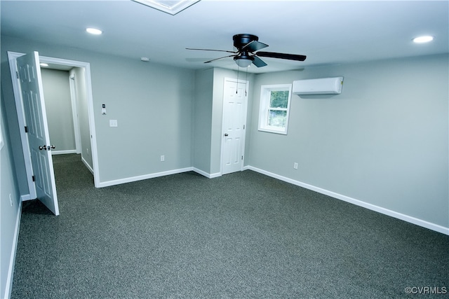 unfurnished bedroom featuring dark colored carpet, ceiling fan, and a wall mounted air conditioner