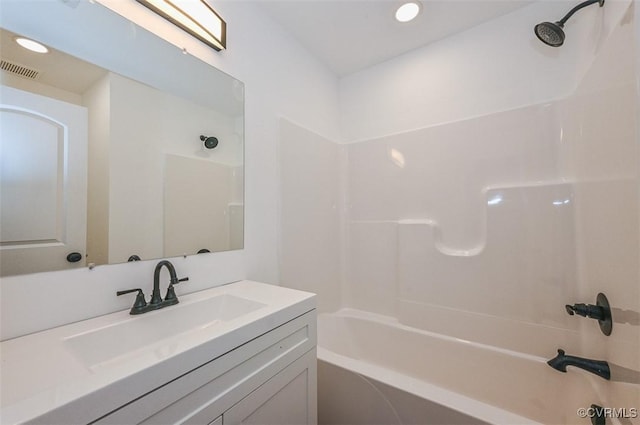 bathroom featuring vanity and shower / washtub combination