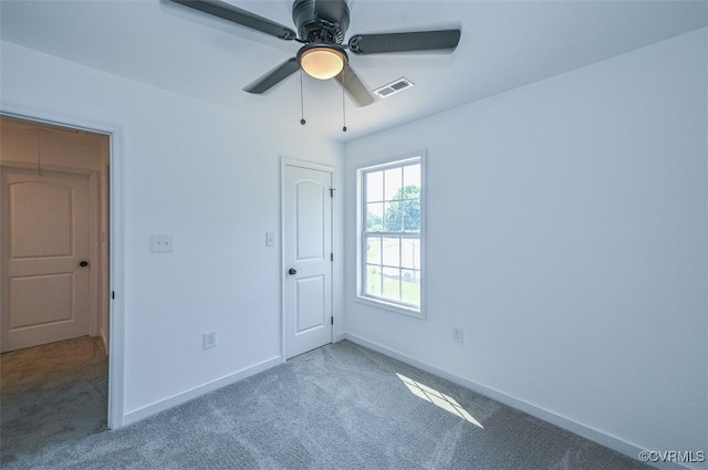 unfurnished bedroom featuring carpet and ceiling fan