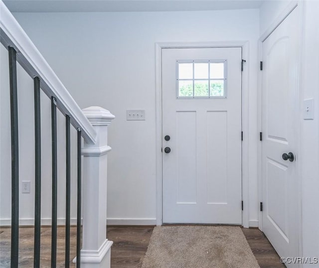 foyer entrance with dark hardwood / wood-style flooring