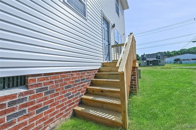 view of home's exterior featuring a yard