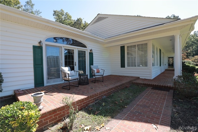 wooden terrace with a patio