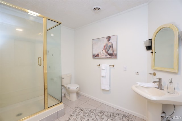 bathroom with tile patterned flooring, a shower with door, a textured ceiling, and toilet