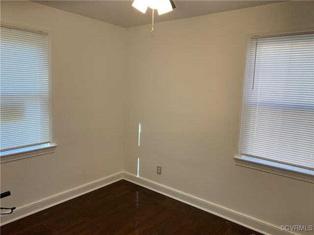 unfurnished room with hardwood / wood-style floors