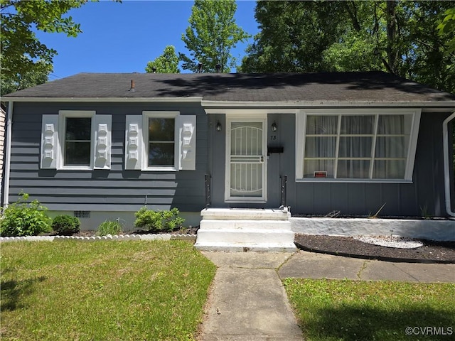 73 Henrico St, Petersburg, VA 23803 - view of front of house with crawl space, a front lawn, and roof with shingles