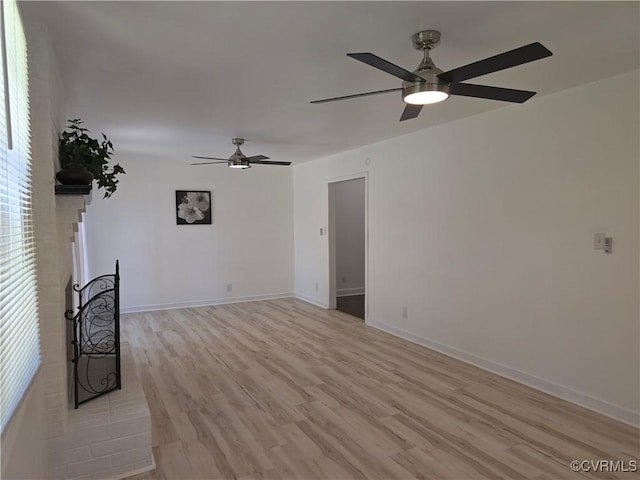 73 Henrico St, Petersburg, VA 23803 - spare room with ceiling fan, light wood-style floors, and baseboards