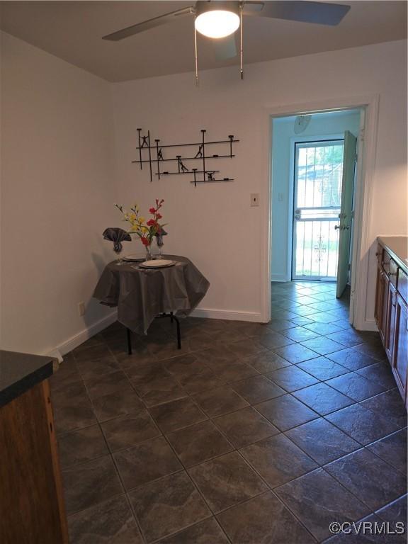 73 Henrico St, Petersburg, VA 23803 - unfurnished dining area featuring ceiling fan and baseboards