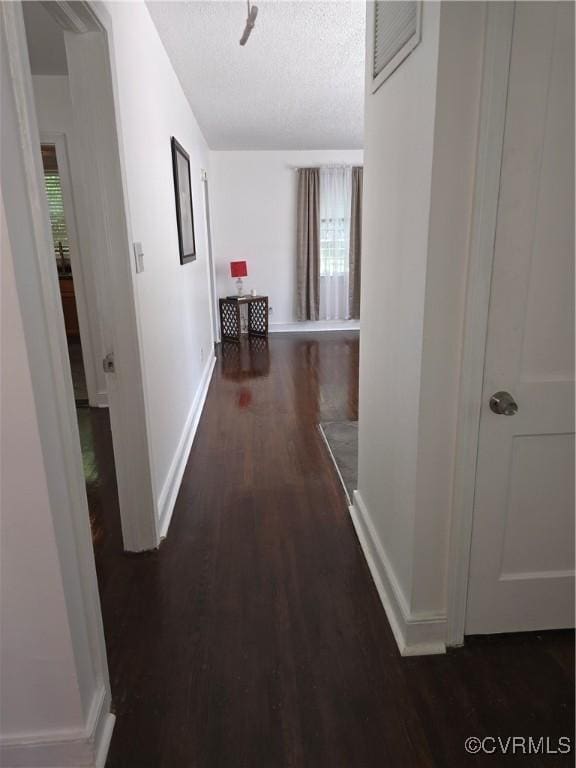 73 Henrico St, Petersburg, VA 23803 - hallway featuring baseboards, wood finished floors, and a textured ceiling