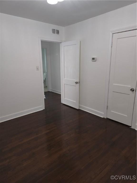 73 Henrico St, Petersburg, VA 23803 - unfurnished room featuring dark wood finished floors and baseboards