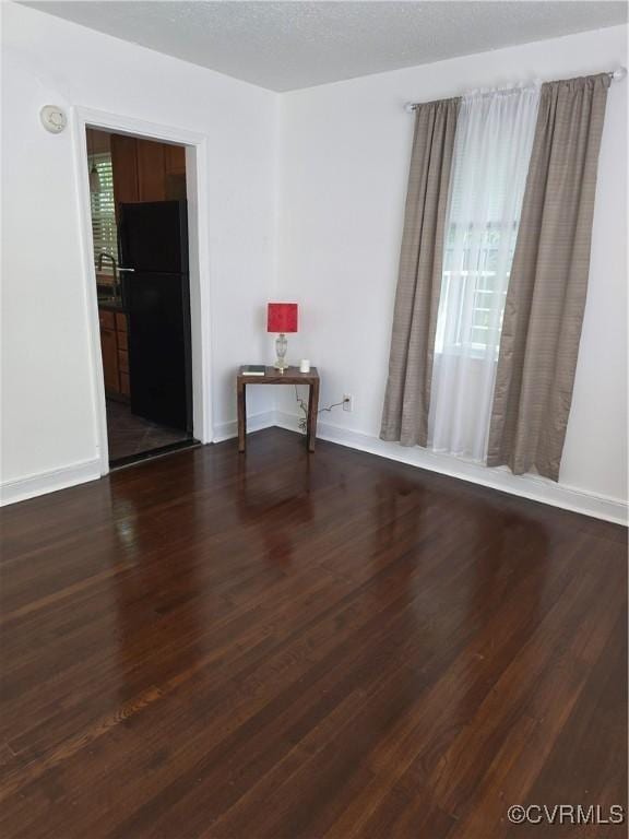 73 Henrico St, Petersburg, VA 23803 - empty room with dark wood-type flooring and baseboards