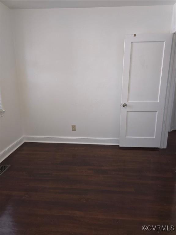 73 Henrico St, Petersburg, VA 23803 - empty room with baseboards and dark wood-style flooring