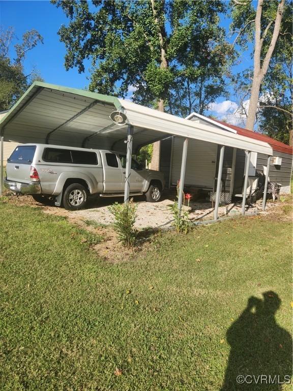 view of parking / parking lot featuring a carport