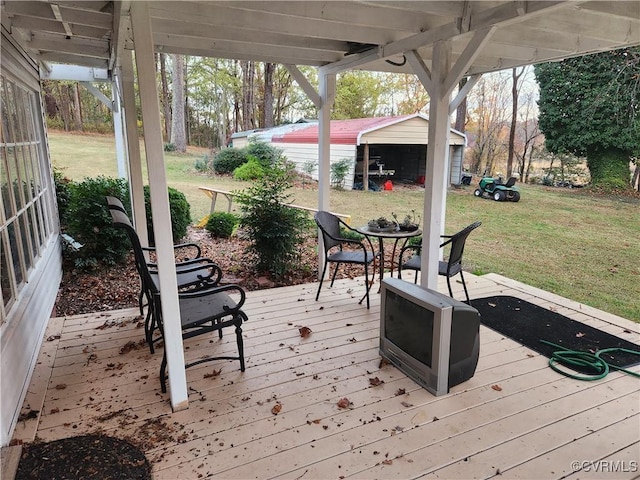 deck with an outbuilding and a yard