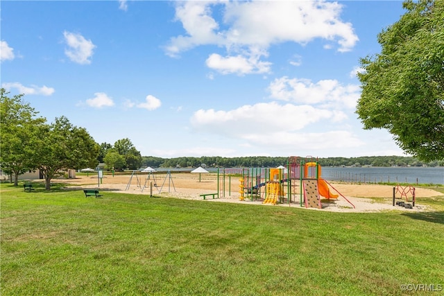 view of playground with a water view and a yard