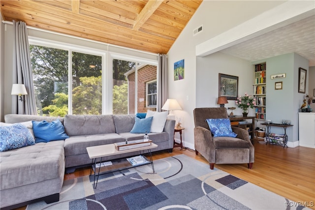 living room featuring wood ceiling, beam ceiling, high vaulted ceiling, and hardwood / wood-style flooring